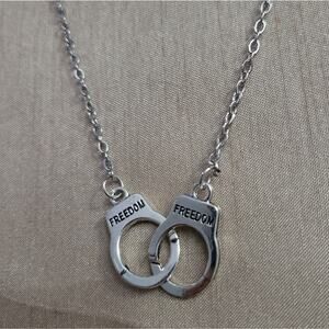 "Freedom" inscribed handcuff charm necklace